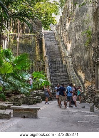 Nassau, Bahamas - May 3, 2019: Tourists Near The Queen's Staircase. The Queen's Staircase, Commonly 