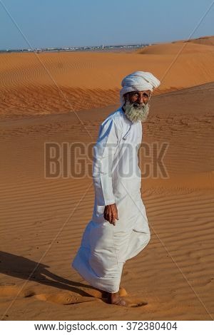 Al Wasil, Oman - March 5, 2017: Local Bedouin In The Sand Dunes Of Sharqiya Wahiba Sands Near Al Was
