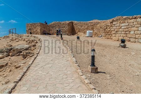 Salalah, Oman - February 25, 2017: Workers And Archeologists At Sumhuram Archaeological Park With Ru