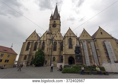 Sibiu, Romania - May 01, 2018: Square In Sibiu, Church And Georg Daniel Teutsch Statue