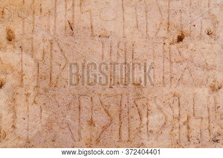 Ancient Kursi Inscriptions In Sumhuram Archaeological Park With Ruins Of Ancient Town Khor Rori Near