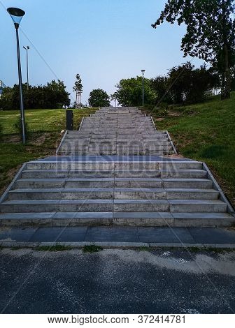 Concrete High Wide Stairs To Path In Park