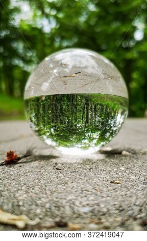 Path In Park Reflected In Crystal Glassy Lens Ball