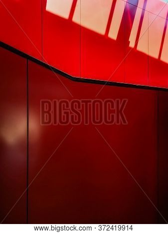 Red Wall With Black Stripes With Sunny Stripes