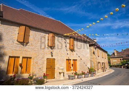 Saint-Leon-sur-Vezere, Dordogne, France - August 17, 2019: Street with historical houses in Saint-Leon-sur-Vezere, Dordogne,France