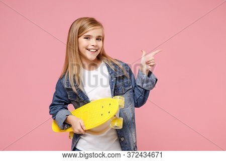 Pretty Little Kid Girl 12-13 Years Old In Denim Jacket Posing Isolated On Pastel Pink Background. Ch