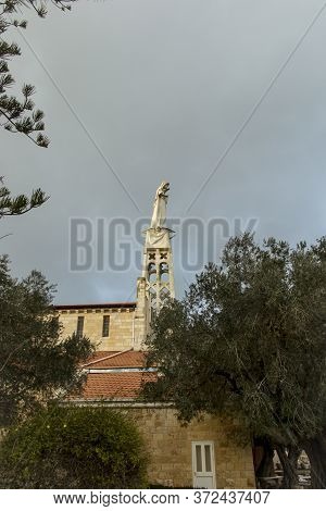 Abu Ghosh, Israel, January 29, 2020: Statue Of The Mother Of God With A Baby In Her Arms On The Roof