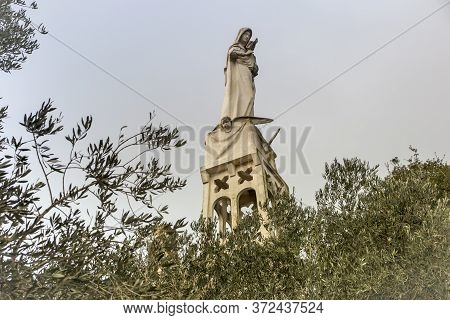 Abu Ghosh, Israel, January 29, 2020: Statue Of The Mother Of God With A Baby In Her Arms On The Roof