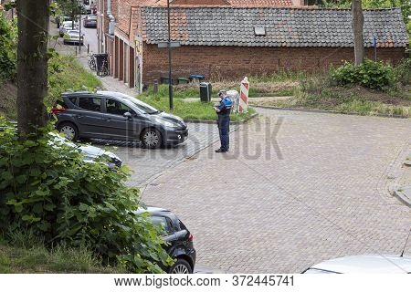 Hulst, The Netherlands June 20, 2020, Profile Of An Enforcer Writing A Ticket