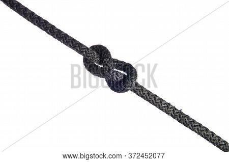 Capstan Knot Made Of Black Rope On A White Background