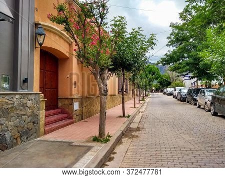 Cafayate, Salta, Argentina. January 17 2020. Photo Of The Cafayate City. Street With Cars, Vegetatio