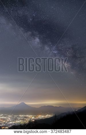Night Scape Of Mountain Fuji With Milky Way And Kofu City. Kofu City Is The Capital City Of Yamanash