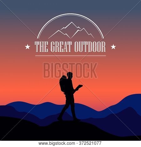 Silhouette Of A Man Against The Background Of A Sunset In The Mountains.