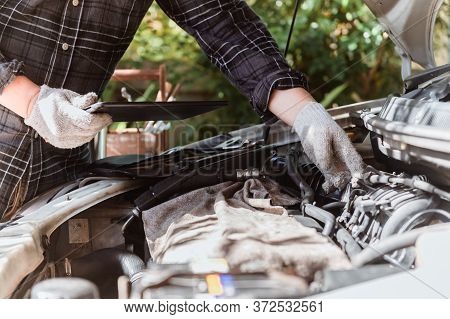 Car Maintenance. Men At Work From Home. Auto Mechanic Repair Engine. Social Distancing And New Norma