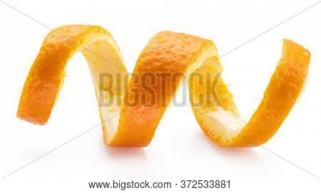 Orange peel or orange twist on white background. Close-up.