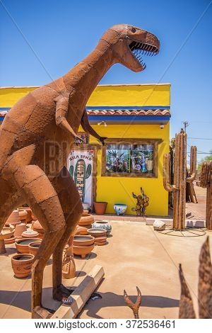 Usa, Arizona 28,06,2016 Dinosaurs And Other Metal Figures Are On Sale In The Street Next To A Mexica