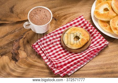 Pandequeso Traditional Colombian Food - Hot Drink Chocolate. Wood Background