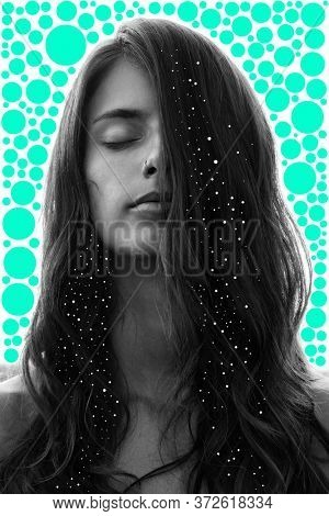 Portrait of a young pretty woman with closed eyes and long wavy hair partially covering her face