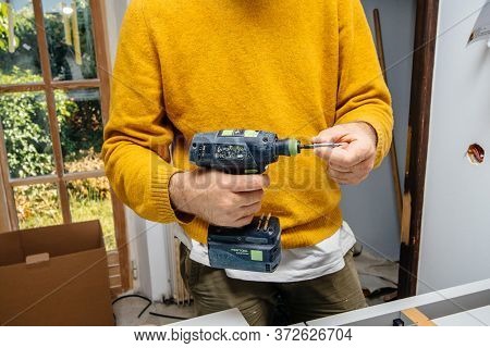Paris, France - Jun 8, 2020: Male Worker Holding In Hand Cordless Drill T 18 Plus 3 C 3, 1-plus With