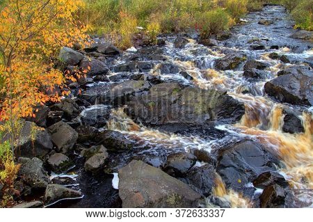 Autumn Waterfall At Roadside Park In The Upper Peninsula Of Michigan In Early October At Tioga Falls