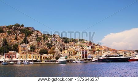 Symi, Greece - June 21, 2020: Symi Town, Symi Island, Pictorial View Of Colorful Houses And  Yialos 