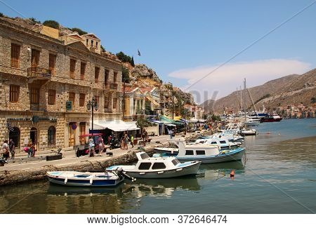Symi, Greece - June 21, 2020: Symi Town, Symi Island, Pictorial View Of Colorful Houses And  Yialos 