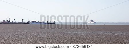 Ameland, The Netherlands On May 30, 2020: The Mud Flats On The Waddensea With The Arrival Of The Fer