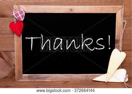 Balckboard With Heart Decoration, Text Thanks, Wooden Background