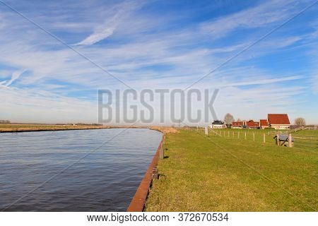 Landscape river the Eem in the Netherlands with village Eemdijk