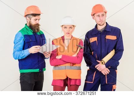 Insubordination Concept. Men And Woman In Helmets