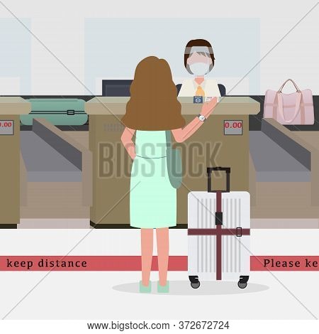 In New Normal Concept. Woman Wear Green Dress Going To Check In At The Airport And Stand Behind Red 