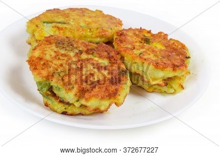 Fried Savory Rice Fritters With Vegetables On The White Dish On A White Background, Close-up In Sele