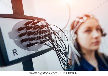 Doctor And Patient With Encephalography Electrode. Electroencephalogram
