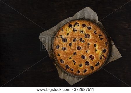 Cherry Pie On A Dark Background. View From Above. Free Space For An Inscription.