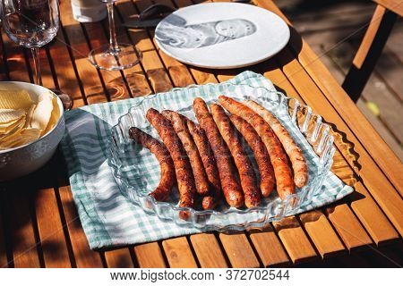 Pork Chipolata. Close-up View Of Fried Sausages. Meat Dish