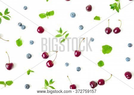 Swet Cherry And Blueberry With Mint On White. Top View. Flat Lay Berry Pattern