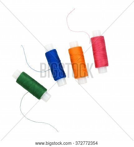 Set Of Spools Of Thread In Different Colors Isolated On White. Flt Lay.