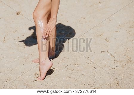 Beach Body Suntan Skin Care Travel Vacation. Bikini Woman Applying Sunscreen Lotion Putting Cream On