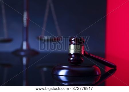Law Symbols Composition. Gavel And Scale On Blue-red Background.