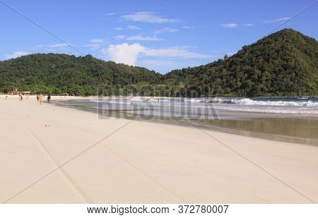 People, White Sand And Waves At Mawun Beach Lombok. Kuta Lombok Is An Exotic Paradise On The Indones