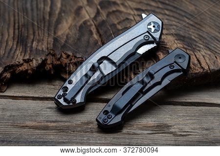 Comparison Of Two Aluminum Handles On Knives. Knives In A Folded Position.