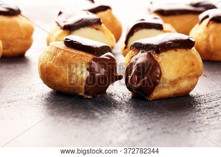 Traditional French Dessert. Eclair With Chocolate Icing. Pastery Dessert Concept