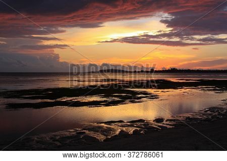 Scenic Sunset From Pantai Sejuk Pundewa Beach View Of Gili Islands Silhouette. Exotic Tropical Desti