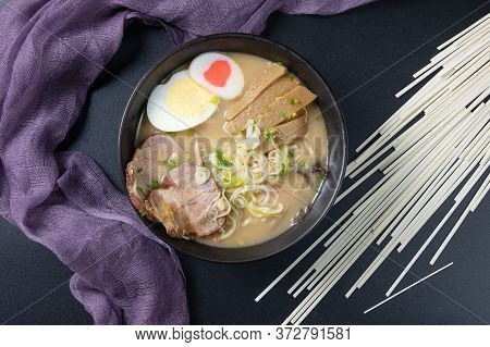 Delicious Tonkotsu Ramen, Japanese Noodle In Pork Bone Based Soup Topped With Chashu Pork, Boiled Eg