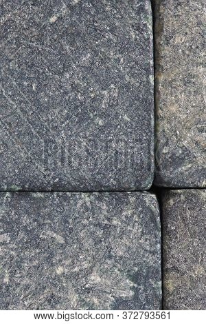 Stone Dark Textured Background Close-up. Natural Gray Backdrop Or Wallpaper. Rough Shabby Surface. S