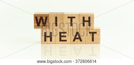 The Words With Heat Written On Wooden Blocks. The Text Is Written In Black Letters And Is Reflected 
