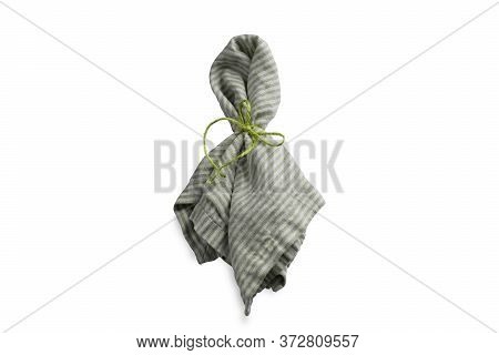 Single Green Table Setting Napkin With Plant Folded