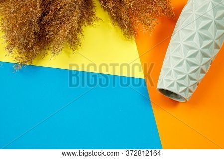 A Minimalistic Composition Of A Light Turquoise Ceramic Vase, Lies An Empty Vase On A Colored Backgr