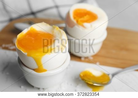 Soft Boiled Chicken Eggs On White Table, Closeup