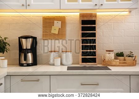 Stylish Kitchen Interior With Modern Coffeemaker On Countertop